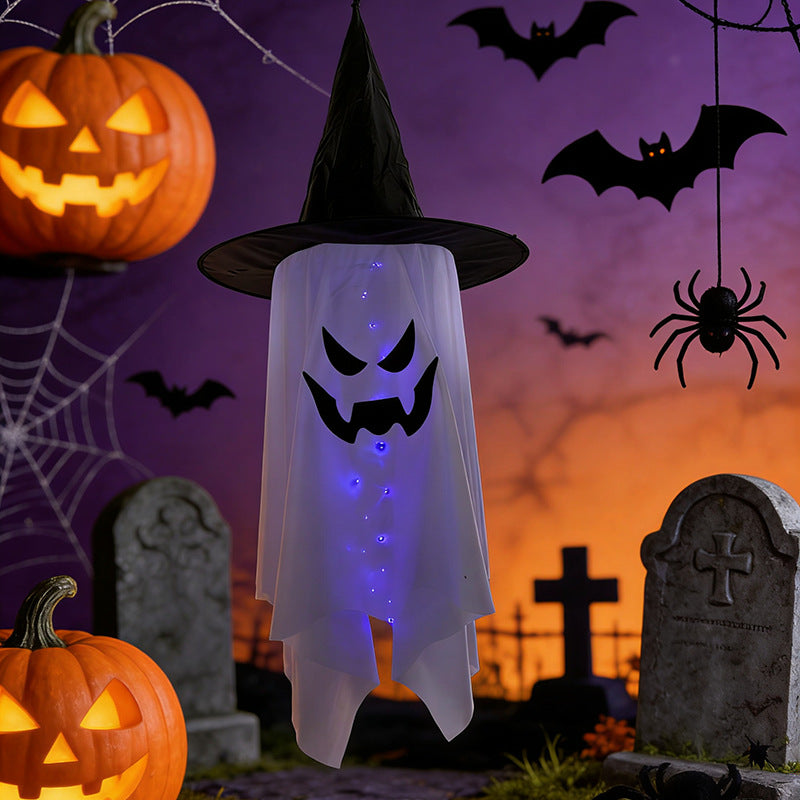 Glowing ghost decorations for Halloween featuring a light-up witch hat ghost with a spooky face.