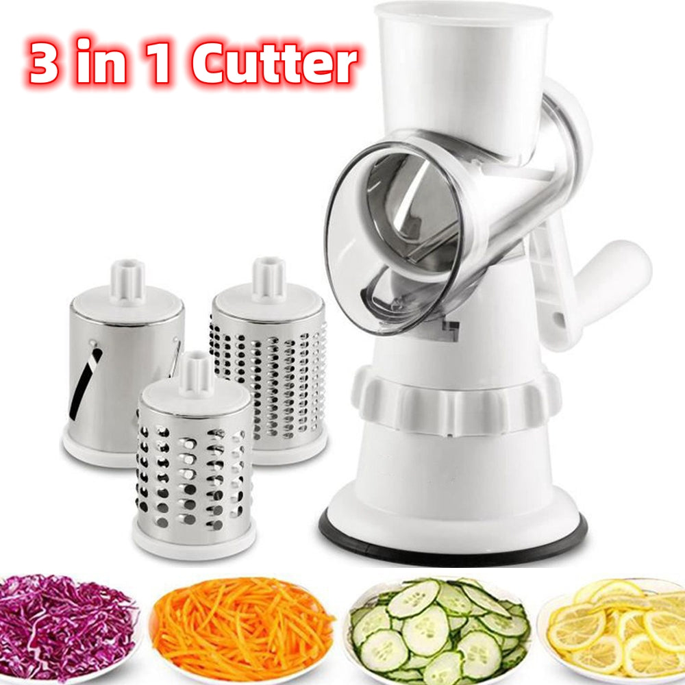 White Rondora hand-cranked vegetable slicer with three metal drum attachments and plates of shredded and sliced vegetables.