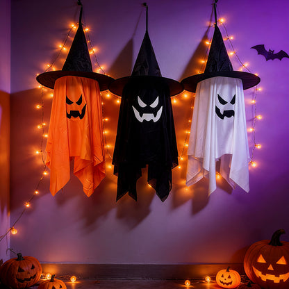 Glowing ghost decorations for Halloween featuring light-up witch hat ghosts in orange, black, and white.