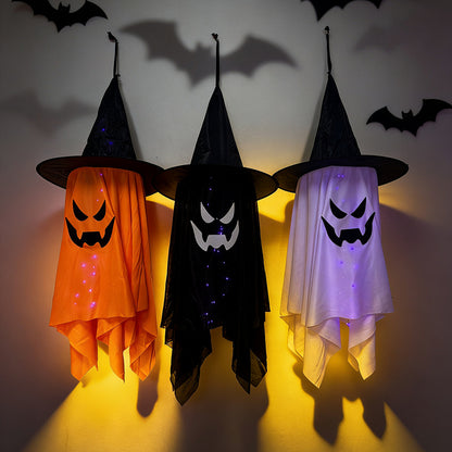 Glowing ghost decorations for Halloween featuring witch hat ghosts in orange, black, and white colors with lights.